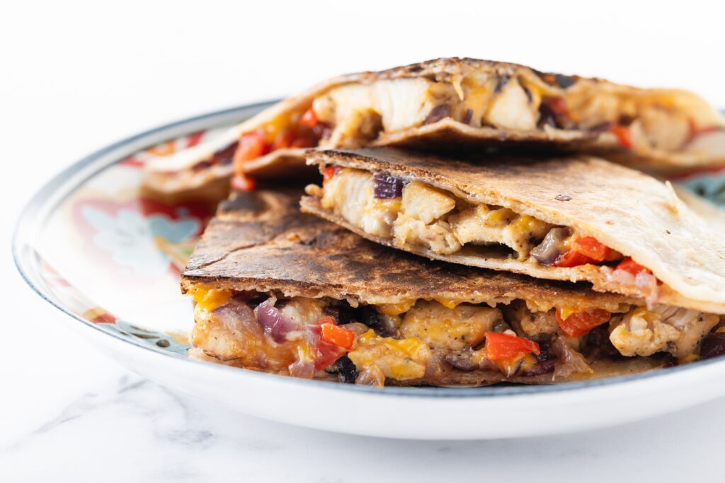 mexican-chicken-quesadillas-with-cheese-peppers-white-marble (1)